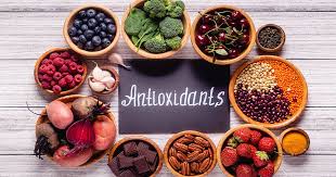 Assorted antioxidants -rich foods, including berries, nuts, vegetables, around the word antioxidant.